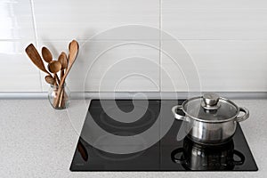 Kitchen with built in ceramic induction stove