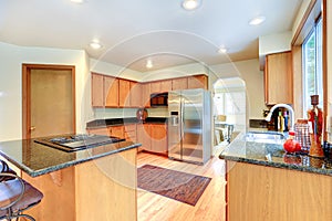 Kitchen cabinets with black granite top.