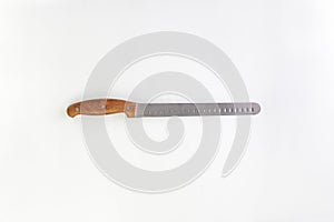Kitchen chef knive for bread laying on white background, flat lay, view from above, space for a text