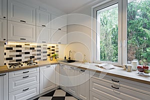 Kitchen with classic white cabinets