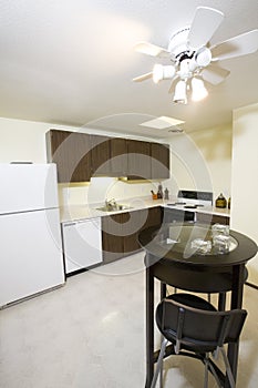 Kitchen in condominium photo