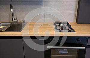 Kitchen counter with newly installed cooker with gas hob burners. Newly renovated house ready for sale or rental.