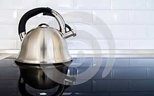 Kitchen countertop. Kitchen hob, stove, kettle. Kitchen interior.