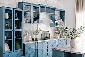 Kitchen cupboard with glass doors, storage drawers and decorative elements