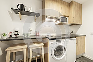 kitchen with dark gray wooden countertops with a coffee maker