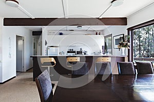 Kitchen and dining area of older style retro funky beach house