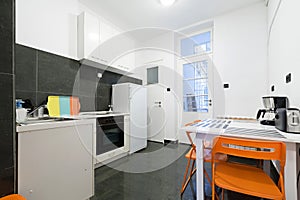 Kitchen and dining room in small apartment photo