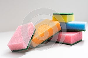 Kitchen dishcloth, cleanup concept, housework. Colorful kitchen sponges for cleaning close-up, housekeeping.