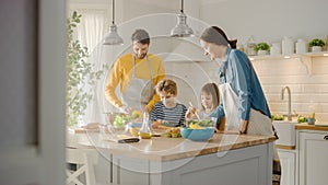 In Kitchen: Family of Four Cooking Together Healthy Dinner. Mother, Father, Little Boy and Girl, P