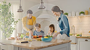 In Kitchen: Family of Four Cooking Together Healthy Dinner. Mother, Father, Little Boy and Girl, P