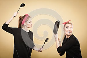 Kitchen fight between retro girls.