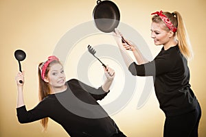 Kitchen fight between retro girls.