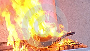 Kitchen fire, burning pan with hot fat