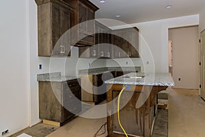 Kitchen furniture set installation in hanging cabinet