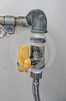 Kitchen Gas shutoff valve. Valve to turn of the kitchen gas. photo