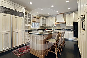 Kitchen with granite and wood island