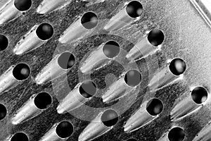 Kitchen grater closeup, textured background