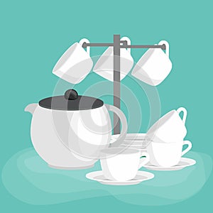 Kitchen household cutlery clean teacups and white ceramic plate stacked. White teapot, cups and saucers in a set for tea