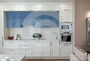 Kitchen interior design with white and blue kitchen furniture