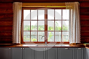 Kitchen interior design of a wooden cottage