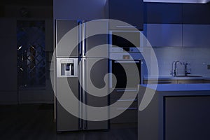 Kitchen interior with four door refrigerator photo