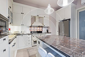 Kitchen Interior with Island, Sink, Tiled Floors in New