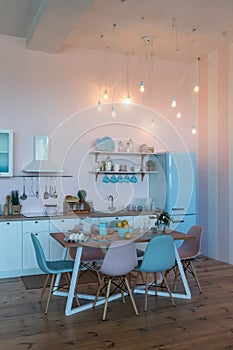 Kitchen interior with large dining table in modern apartment