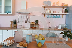 Kitchen interior with large dining table in modern apartment