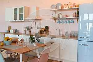 Kitchen interior with large dining table in modern apartment