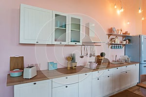 Kitchen interior with large dining table in modern apartment