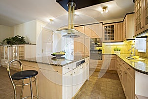 Kitchen island in designed kitchen photo