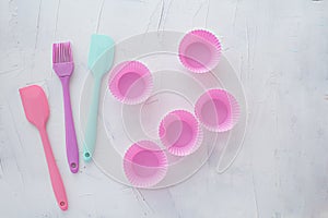Kitchen items for baking on a white textural background