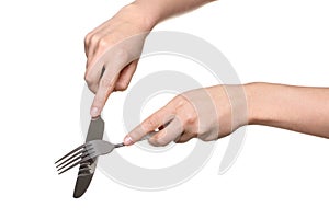 Kitchen knife and fork in the hands