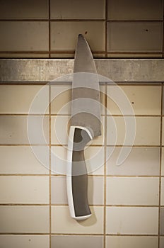 Kitchen knife hanging on a wall