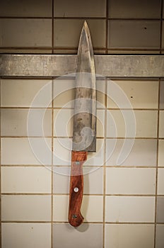Kitchen knife hanging on a wall