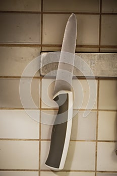 Kitchen knife hanging on a wall