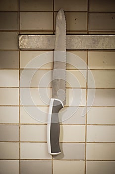 Kitchen knife hanging on a wall