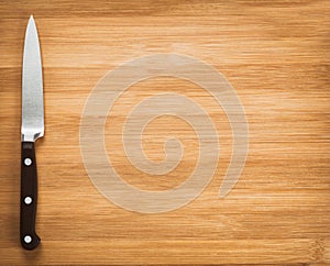 Kitchen knife on a wooden background