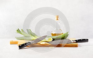 Kitchen knives are lying on a cutting board during the cooking process