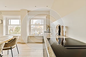 a kitchen with a large counter top and a window