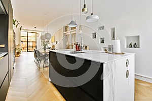 a kitchen with a large island and a dining room