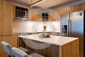 Kitchen with a led ilumination and a Big interior space