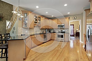 Kitchen with long granite counter