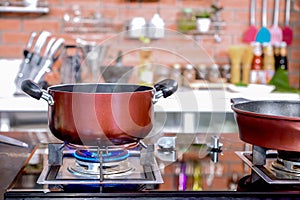 Kitchen luxury cooking closeup pot and pan on the gas stove