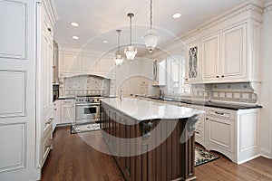 Kitchen with marble and wood island