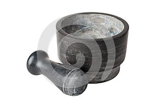Kitchen mortar and pestle made of dark stone, isolated on a white background, close-up, spices
