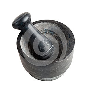 Kitchen mortar and pestle made of dark stone, isolated on a white background, close-up, spices