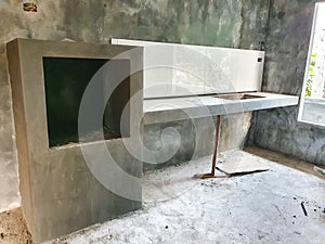 The kitchen in the new home under construction has a counter and an oven compartment