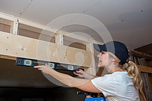 Kitchen Remodel Young Woman with Level Side