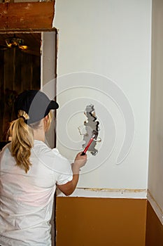 Kitchen Remodel Young Woman Making Large Hole in Wall